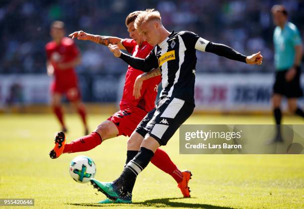 Mike Frantz of Freiburg challenges Oscar Wendt of Moenchengladbach during the Bundesliga match between Borussia Moenchengladbach and Sport-Club...