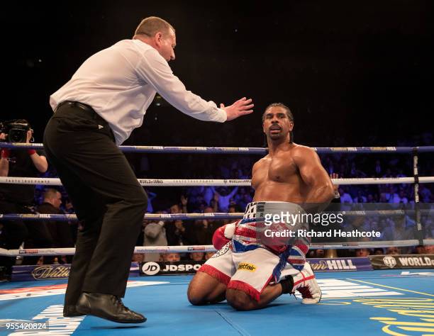 Referee Howard Foster gives David Haye a count in the 5th round during the Heavyweight contest between Tony Bellew and David Haye at The O2 Arena on...