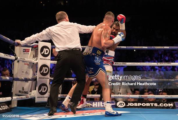 Referee Howard Foster jumps in to stop the fight in the 5th round during the Heavyweight contest between Tony Bellew and David Haye at The O2 Arena...