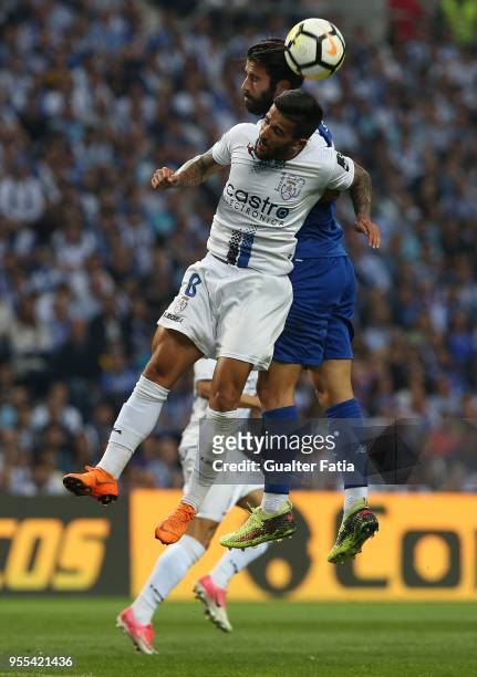 Feirense midfielder Tiago Silva from Portugal with FC Porto midfielder Sergio Oliveira from Portugal in action during the Primeira Liga match between...