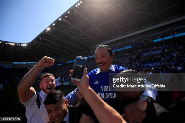 Cardiff City owner Vincent Tan is carried by the fans in celebration during the Sky Bet Championship match between Cardiff City and Reading at...