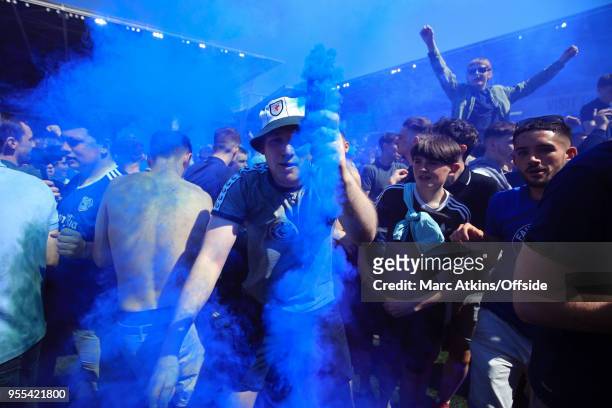 Cardiff City fan dances in celebration with a smoke bomb during the Sky Bet Championship match between Cardiff City and Reading at Cardiff City...