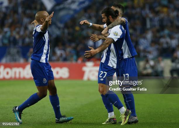 Porto midfielder Sergio Oliveira from Portugal celebrates with teammates after scoring a goal during the Primeira Liga match between FC Porto and CD...