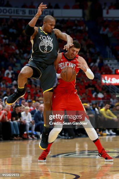 Nikola Mirotic of the New Orleans Pelicans is fouled by David West of the Golden State Warriors during the first half of Game Four of the Western...