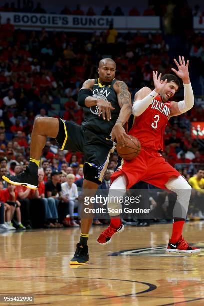 Nikola Mirotic of the New Orleans Pelicans is fouled by David West of the Golden State Warriors during the first half of Game Four of the Western...