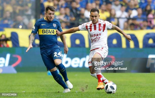 Franco Fragapane of Union fights for the ball with Julio Buffarini of Boca Juniors during a match between Boca Juniors and Union de Santa Fe as part...