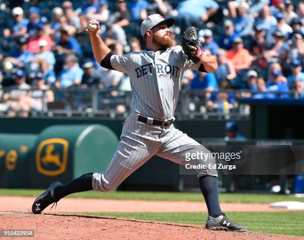Buck Farmer of the Detroit Tigers throws in the eighth inning against the Kansas City Royals at Kauffman Stadium on May 6, 2018 in Kansas City,...