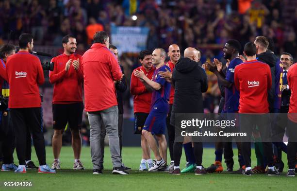 Andres Iniesta of Barcelona ceebrates with team mates after the La Liga match between Barcelona and Real Madrid at Camp Nou on May 6, 2018 in...