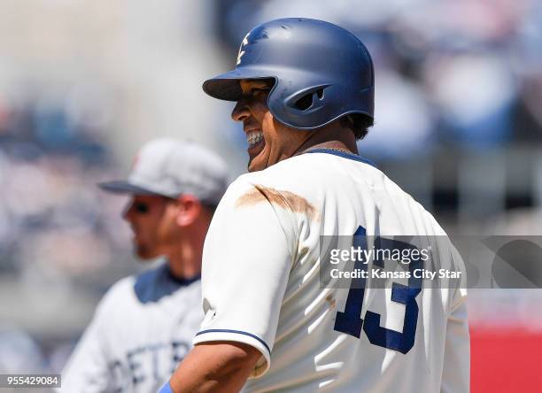 Kansas City Royals' Salvador Perez smiles after his single that scored Mike Moustakas in the third inning, on a ball that was lost in the sun by...