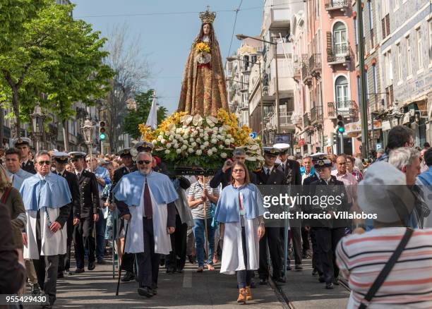 Faithful carry a figure of Our Lady of Health during procession in the Virgin honor at Moraria neighborhood on May 06, 2018 in Lisbon, Portugal. Our...