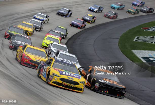 Ricky Stenhouse Jr., driver of the Little Hug Fruit Barrels Ford, leads a pack of cars during the Monster Energy NASCAR Cup Series AAA 400 Drive for...