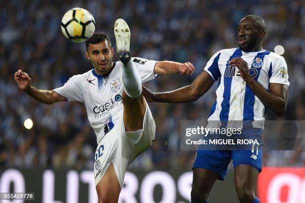 Feirense's Brazilian midfielder Rafael Crivellaro challenges Porto's Malian forward Moussa Marega during the Portuguese league football match between...