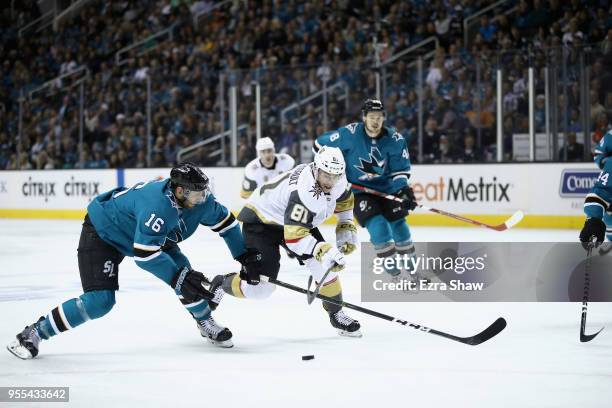 Eric Fehr of the San Jose Sharks and Jonathan Marchessault of the Vegas Golden Knights go for the puck during Game Four of the Western Conference...