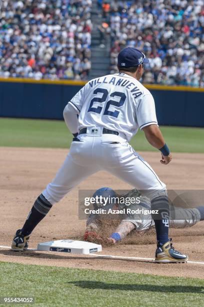 Center fielder Alex Verdugo of Los Angeles Dodgers dives to third base after a hit by second base Tim Locastro in the second inning during the MLB...