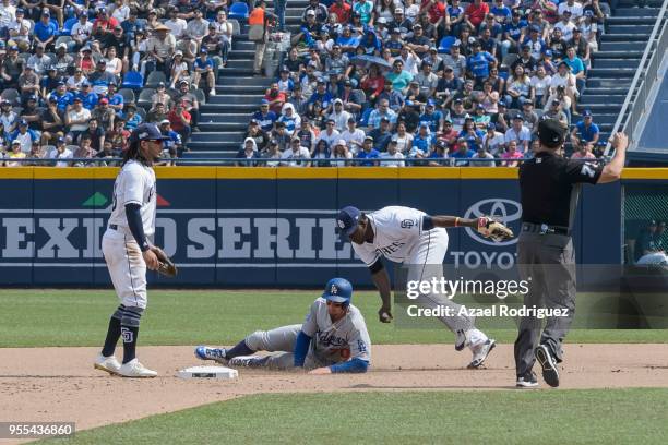 Second base Tim Locastro of Los Angeles Dodgers gets outed on second base in the fourth inning during the MLB game against the San Diego Padres at...