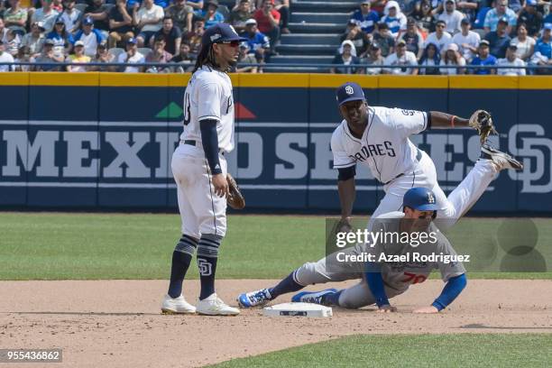 Second base Tim Locastro of Los Angeles Dodgers gets outed on second base in the fourth inning during the MLB game against the San Diego Padres at...