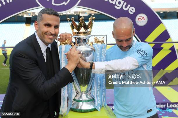 Khaldoon Al Mubarak the chairman of Manchester City and Pep Guardiola the head coach / manager of Manchester City with the Premier League trophy...