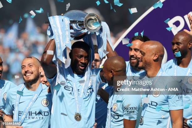 Yaya Toure of Manchester City with the Premier League trophy during the championship celebrations after the Premier League match between Manchester...