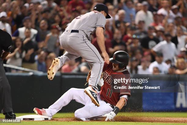 Pollock of the Arizona Diamondbacks triples in the sixth inning of the MLB game against Alex Bregman of the Houston Astros at Chase Field on May 6,...