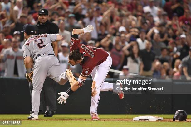 Pollock of the Arizona Diamondbacks runs home to score on an interference error by Alex Bregman of the Houston Astros in the sixth inning of the MLB...