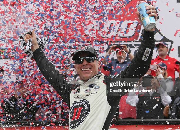 Kevin Harvick, driver of the Jimmy John's Ford, celebrates in victory lane after winning the Monster Energy NASCAR Cup Series AAA 400 Drive for...