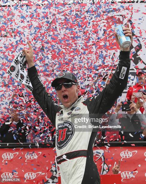 Kevin Harvick, driver of the Jimmy John's Ford, celebrates in victory lane after winning the Monster Energy NASCAR Cup Series AAA 400 Drive for...