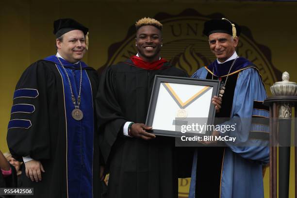 Corey Clement, Running Back for the Philadelphia Eagles, recieves the Rowand University Medal of Excellence for Community Engagement from James...