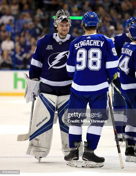 Andrei Vasilevskiy and Mikhail Sergachev of the Tampa Bay Lightning celebrate winning Game Five of the Eastern Conference Second Round against the...