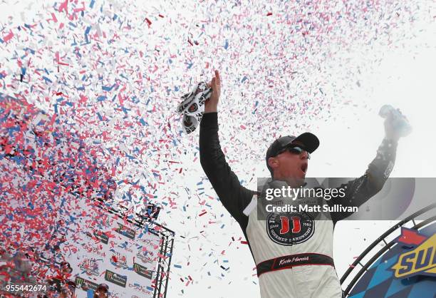 Kevin Harvick, driver of the Jimmy John's Ford, celebrates in victory lane after winning the Monster Energy NASCAR Cup Series AAA 400 Drive for...