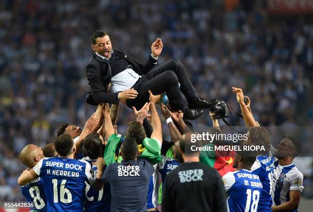 Porto's players carry their Portuguese coach Sergio Conceicao as they celebrate winning the league title after the Portuguese league football match...