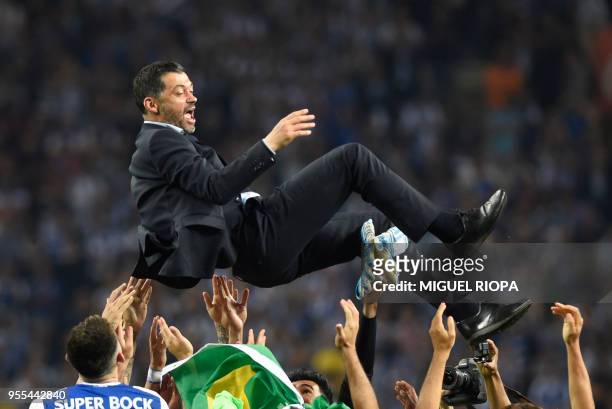 Porto's players carry their Portuguese coach Sergio Conceicao as they celebrate winning the league title after the Portuguese league football match...