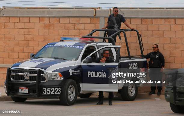 Police officers are seen prior to the quarter finals second leg match between Santos Laguna and Tigres UANL as part of the Torneo Clausura 2018 Liga...