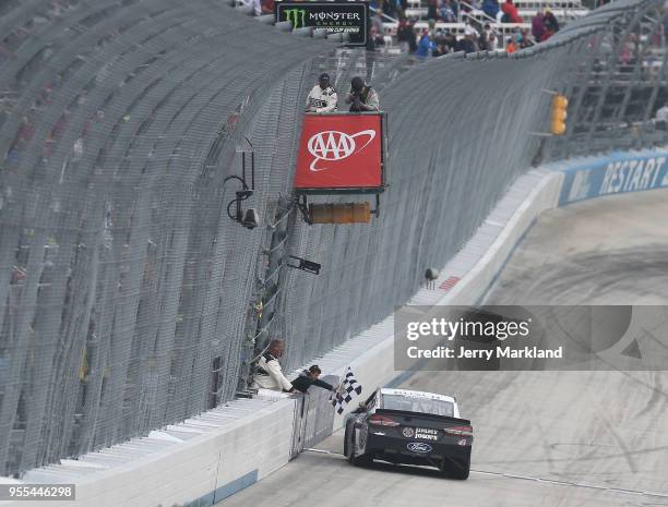 Kevin Harvick, driver of the Jimmy John's Ford, celebrates with the checkered flag after winning the Monster Energy NASCAR Cup Series AAA 400 Drive...