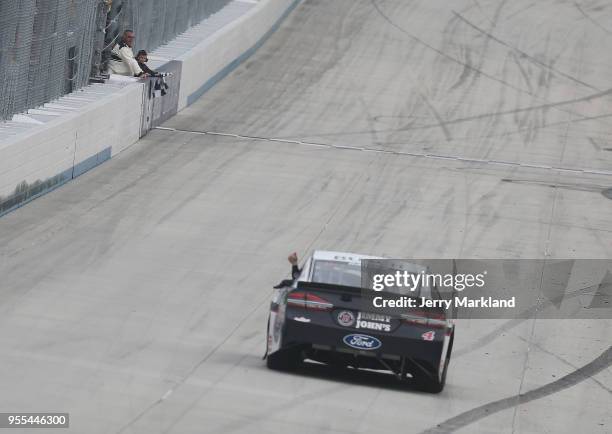 Kevin Harvick, driver of the Jimmy John's Ford, celebrates with the checkered flag after winning the Monster Energy NASCAR Cup Series AAA 400 Drive...