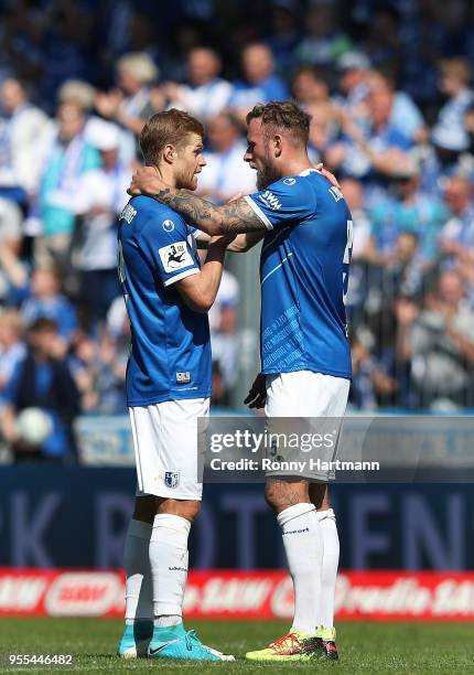 Andre Hainault and Felix Schiller of 1. FC Magdeburg celebrate after the 3. Liga match between 1. FC Magdeburg and Chemnitzer FC at MDCC-Arena on May...