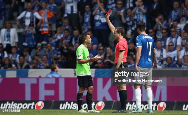 Mikko Sumusalo of Chemnitzer FC receives a red card for a second yellow card by referee Jonas Weickenmeier next to Christian Beck of 1. FC Magdeburg...