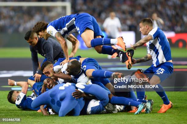Porto's players celebrate after winning the league title following the Portuguese league football match between FC Porto and CD Feirense at the...