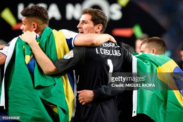 Porto's Spanish goalkeeper Iker Casillas celebrates with teammates after winning the league title following the Portuguese league football match...