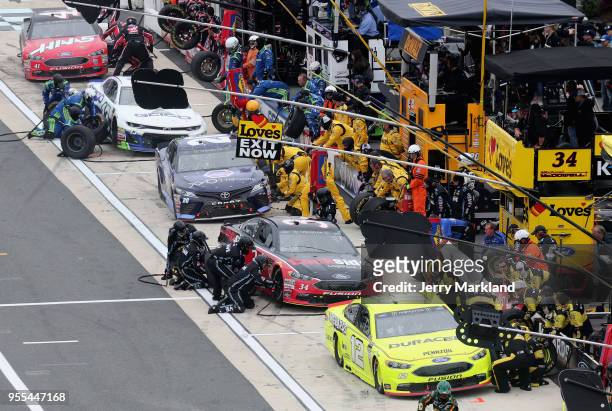 Ryan Blaney, driver of the Menards/Duracell Ford, pits during the Monster Energy NASCAR Cup Series AAA 400 Drive for Autism at Dover International...