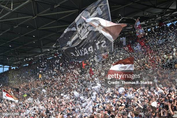 Supporters of Hamburg cheer their team during the Second Bundesliga match between FC St. Pauli and DSC Arminia Bielefeld at Millerntor Stadium on May...