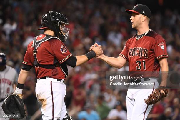 Alex Avila and Brad Boxberger of the Arizona Diamondbacks celebrate the win over the Houston Astros at Chase Field on May 6, 2018 in Phoenix,...