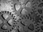 The gears of a mechanism on metal wall