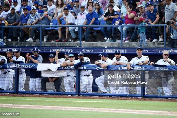 Members of the San Diego Padres look on from the dugout during the game against the Los Angeles Dodgers at Estadio de Béisbol Monterrey on Sunday,...