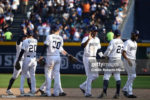 Members of the San Diego Padres celebrate after defeating the Los Angeles Dodgers at Estadio de Béisbol Monterrey on Sunday, May 6, 2018 in...