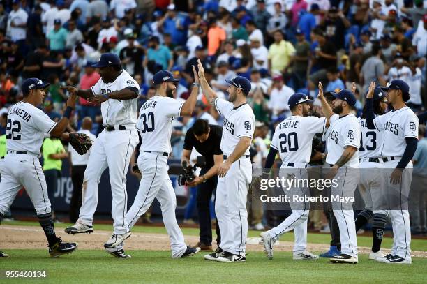 Members of the San Diego Padres celebrate after defeating the Los Angeles Dodgers at Estadio de Béisbol Monterrey on Sunday, May 6, 2018 in...