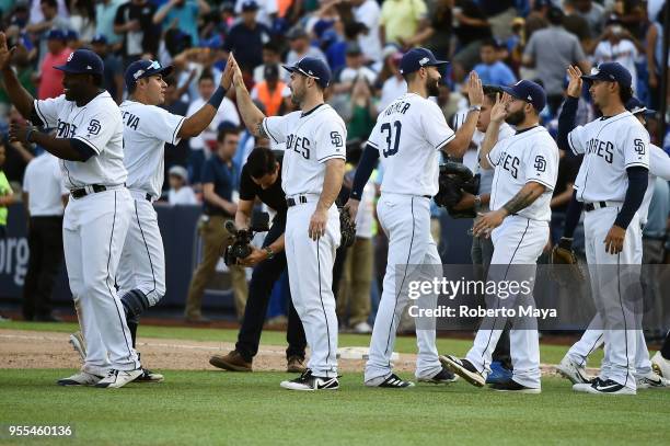 Members of the San Diego Padres celebrate after defeating the Los Angeles Dodgers at Estadio de Béisbol Monterrey on Sunday, May 6, 2018 in...