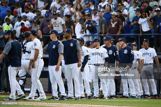 Members of the San Diego Padres celebrate after defeating the Los Angeles Dodgers at Estadio de Béisbol Monterrey on Sunday, May 6, 2018 in...