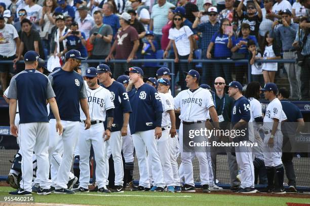 Members of the San Diego Padres celebrate after defeating the Los Angeles Dodgers at Estadio de Béisbol Monterrey on Sunday, May 6, 2018 in...