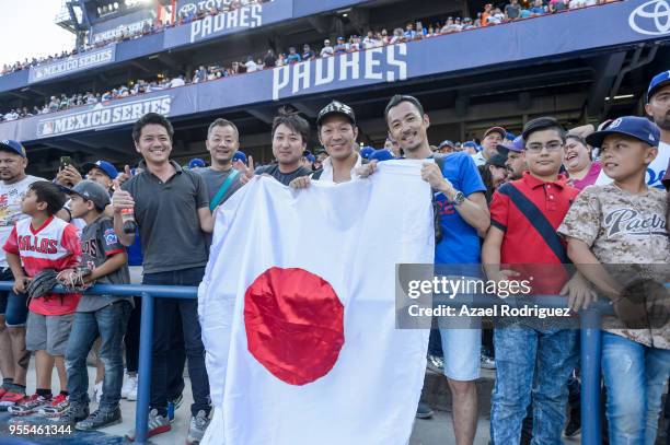 Fans hold a Japanese flag during the MLB game between the San Diego Padres and the Los Angeles Dodgers at Estadio de Beisbol Monterrey on May 6, 2018...