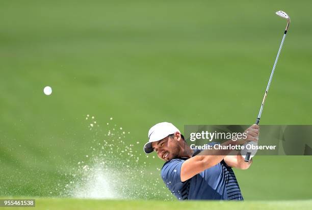 Golfer Jason Day hits from a sand trap along the fifth green during fourth round action of the Wells Fargo Championship on Sunday, May 6, 2018 at...